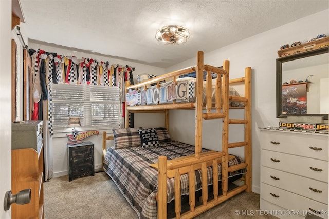 carpeted bedroom with a textured ceiling