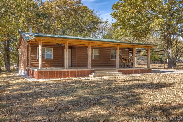 log cabin with a porch