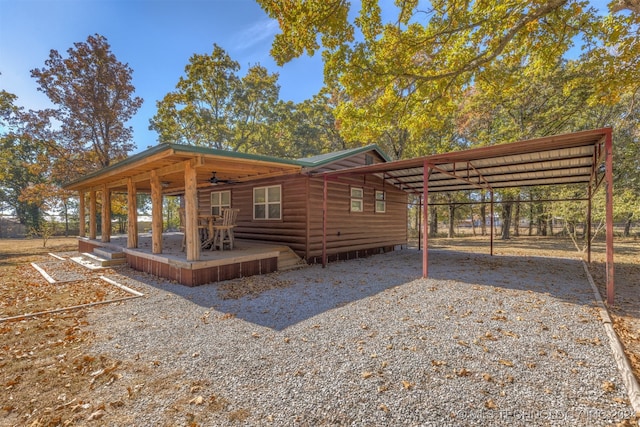 rear view of property with ceiling fan