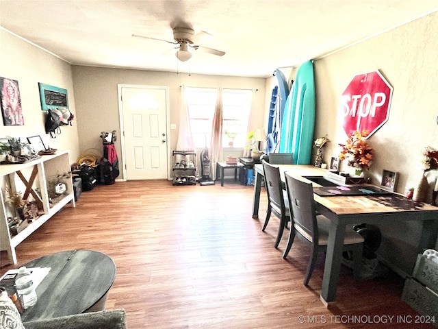 dining room with light hardwood / wood-style flooring and ceiling fan