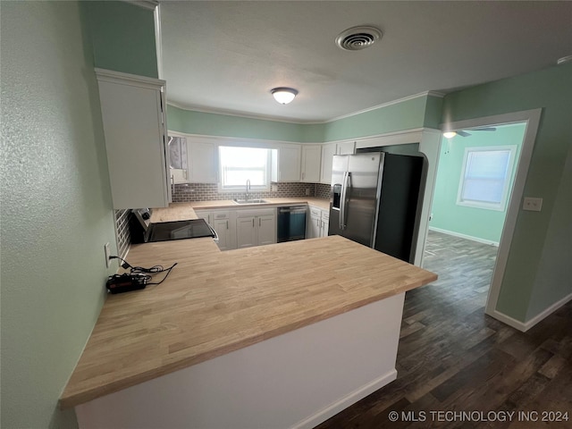 kitchen with dishwasher, white cabinetry, tasteful backsplash, stainless steel fridge with ice dispenser, and kitchen peninsula