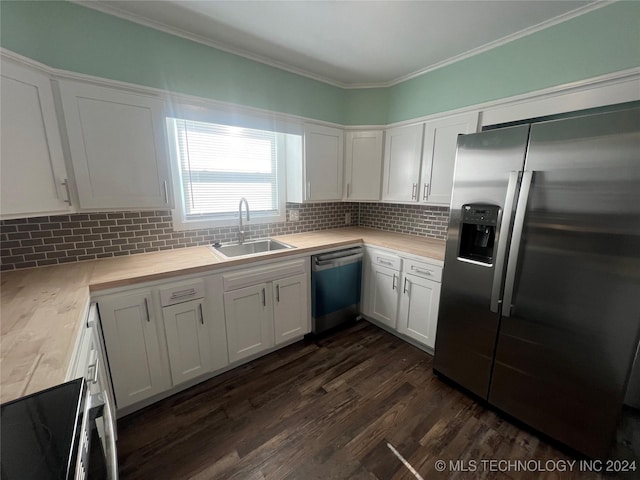 kitchen with white cabinetry, appliances with stainless steel finishes, dark hardwood / wood-style floors, and sink