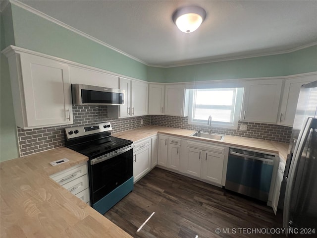 kitchen featuring sink, dark hardwood / wood-style floors, white cabinets, and appliances with stainless steel finishes