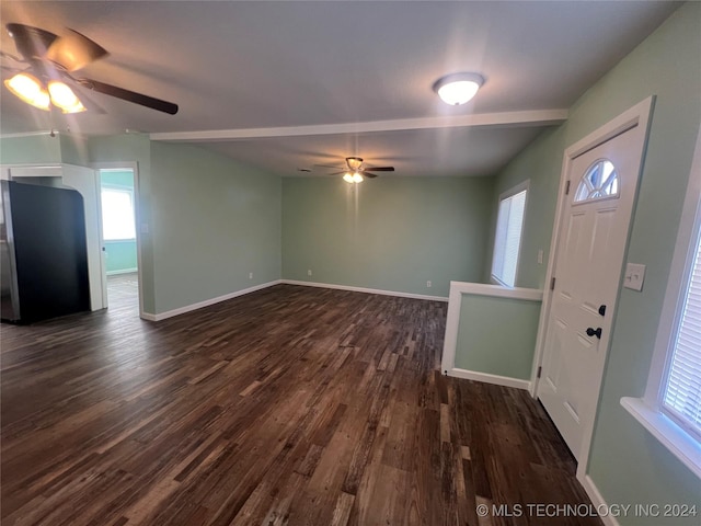 foyer featuring dark wood-type flooring and ceiling fan