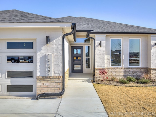 entrance to property featuring a garage