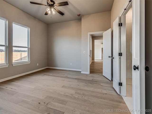 spare room with light hardwood / wood-style floors and ceiling fan