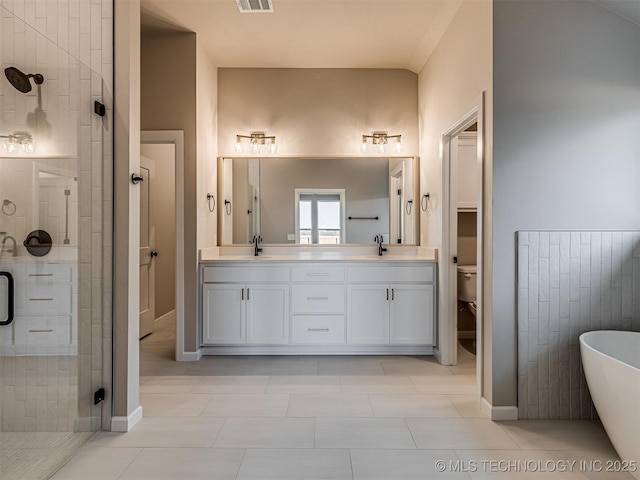 full bathroom with separate shower and tub, tile patterned floors, vanity, and toilet