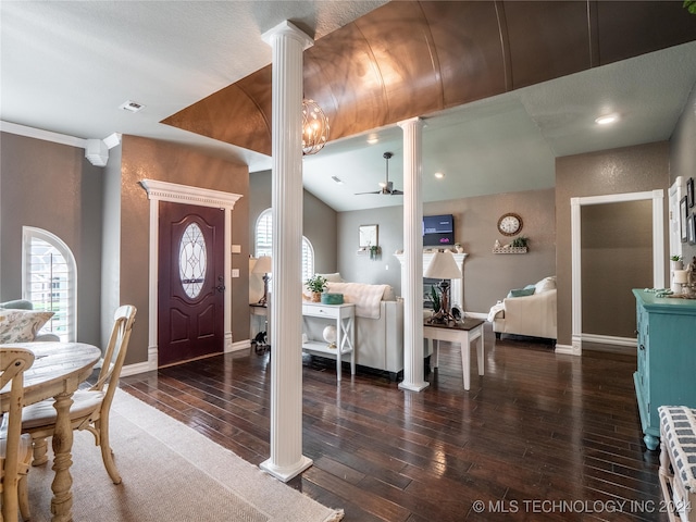 entryway featuring decorative columns, dark wood-type flooring, and ceiling fan