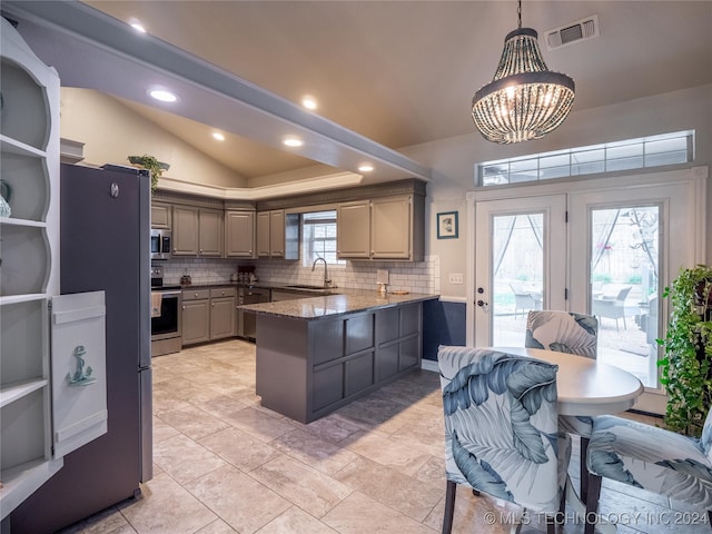 kitchen with gray cabinetry, stainless steel appliances, sink, pendant lighting, and tasteful backsplash