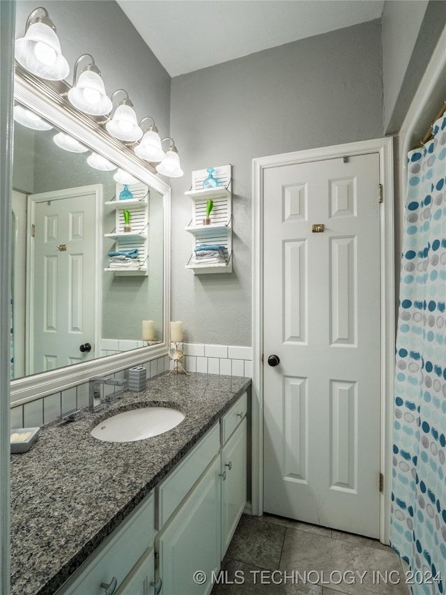 bathroom featuring vanity and tile patterned flooring