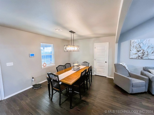 dining space featuring dark hardwood / wood-style flooring