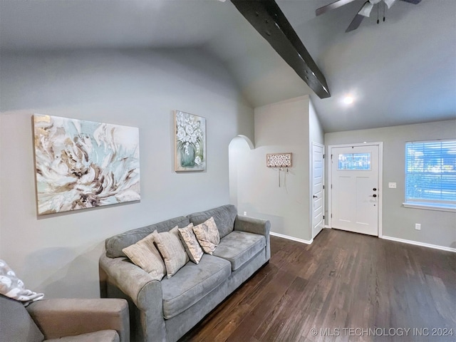 living room with vaulted ceiling with beams, dark hardwood / wood-style floors, and ceiling fan