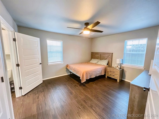 bedroom featuring dark hardwood / wood-style flooring and ceiling fan