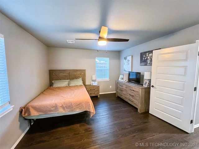 bedroom featuring ceiling fan and dark hardwood / wood-style floors