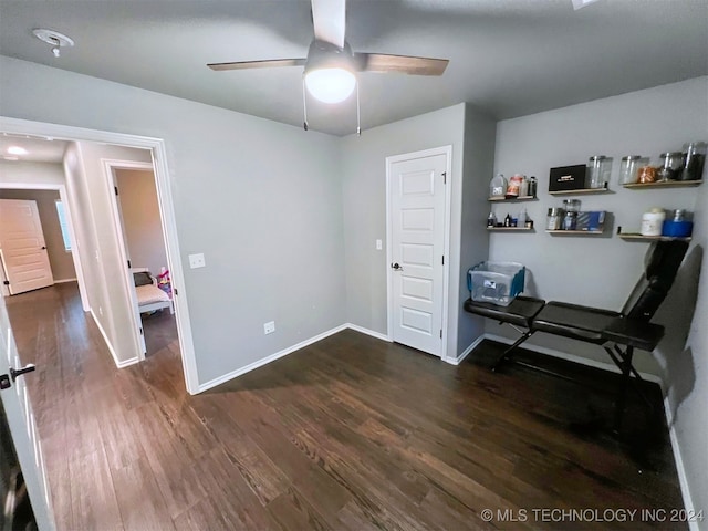 unfurnished bedroom with dark wood-type flooring and ceiling fan