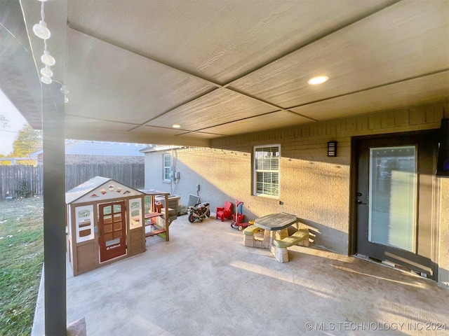 view of patio / terrace featuring an outbuilding