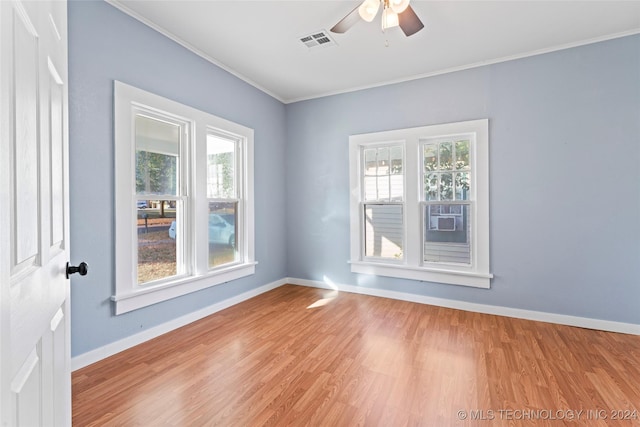 unfurnished room with light hardwood / wood-style flooring, ceiling fan, and ornamental molding