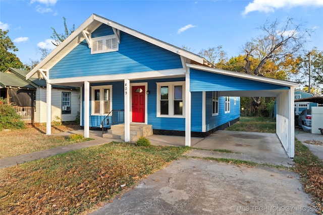 bungalow-style home featuring a carport