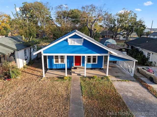 bungalow-style house with a carport
