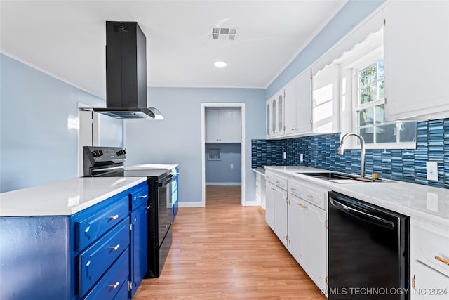 kitchen with blue cabinetry, sink, island range hood, white cabinets, and black appliances
