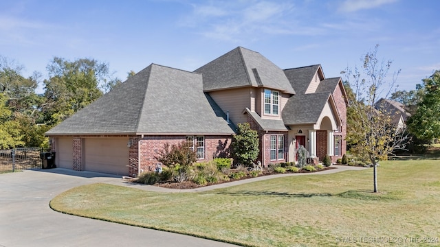 view of front of house with a garage and a front yard