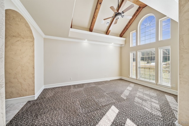 unfurnished room with ceiling fan, high vaulted ceiling, carpet flooring, beamed ceiling, and crown molding