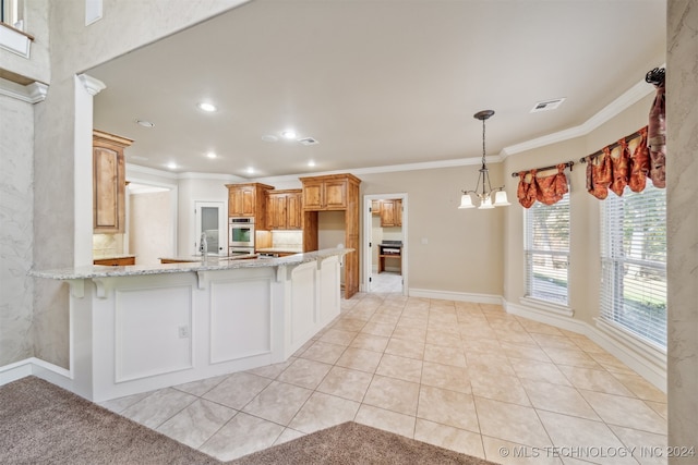 kitchen with crown molding, light tile patterned floors, kitchen peninsula, and stainless steel double oven