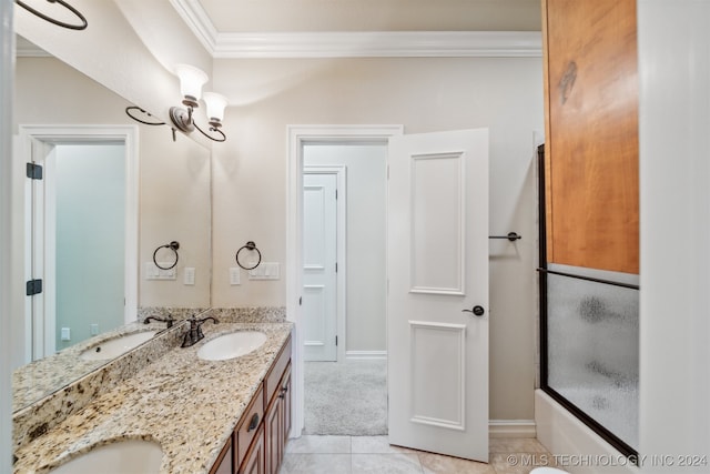 bathroom with vanity, crown molding, enclosed tub / shower combo, and tile patterned flooring