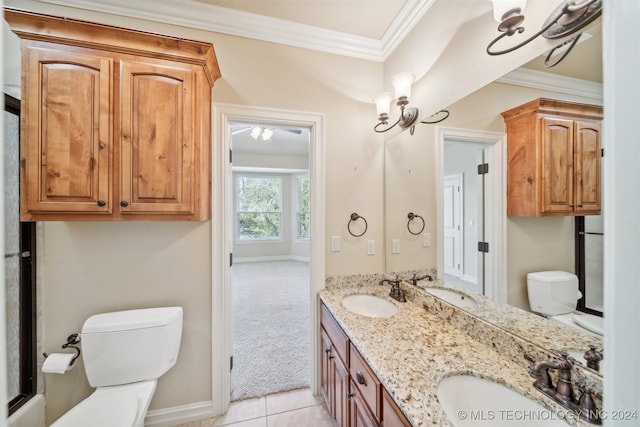 bathroom featuring vanity, tile patterned flooring, crown molding, and toilet