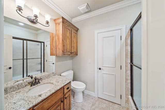 bathroom with toilet, tile patterned flooring, crown molding, vanity, and walk in shower