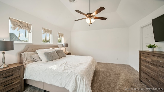 carpeted bedroom featuring lofted ceiling and ceiling fan