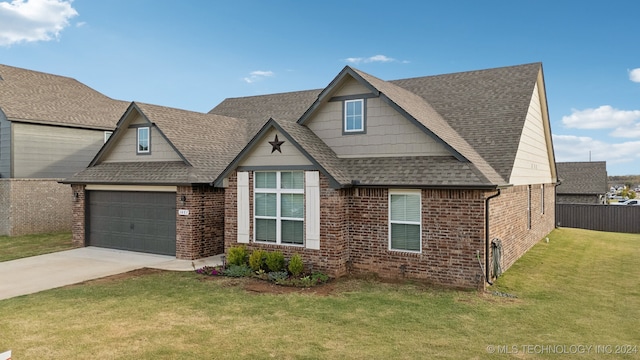 view of front of house with a front lawn and a garage