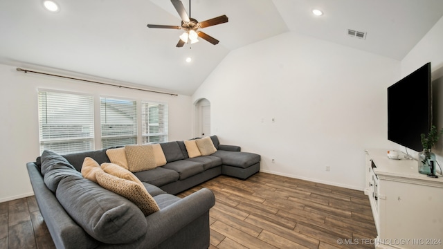 living room featuring ceiling fan, hardwood / wood-style flooring, and high vaulted ceiling