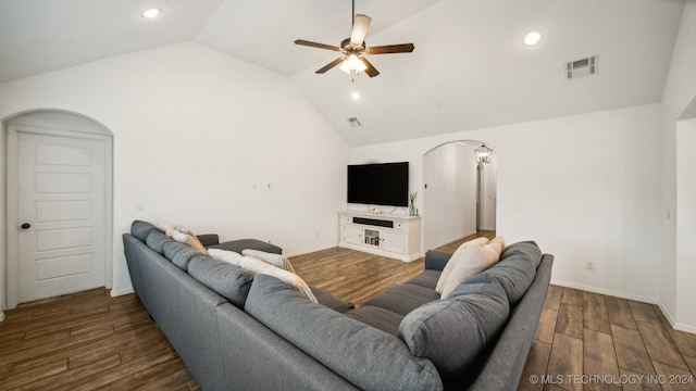 living room featuring ceiling fan, high vaulted ceiling, and dark hardwood / wood-style flooring