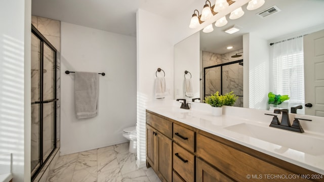 bathroom featuring vanity, toilet, and walk in shower