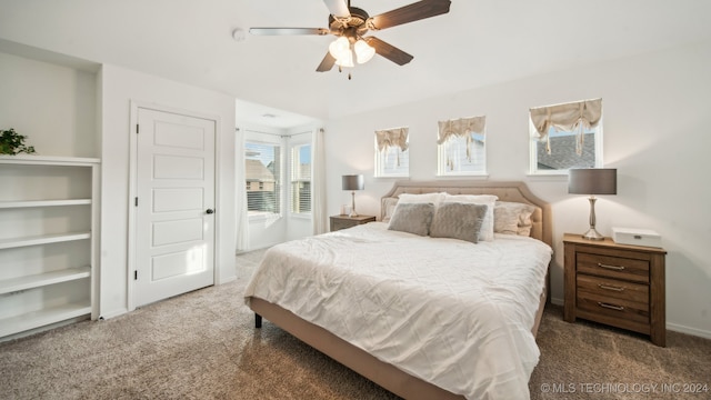 carpeted bedroom with ceiling fan