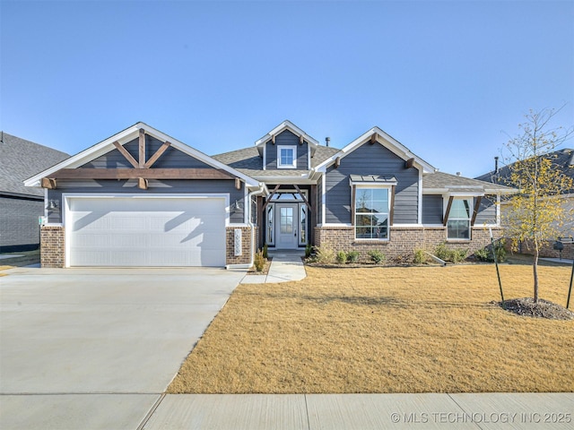 craftsman inspired home featuring a front yard and a garage