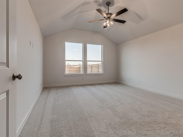 additional living space with ceiling fan, light carpet, and vaulted ceiling