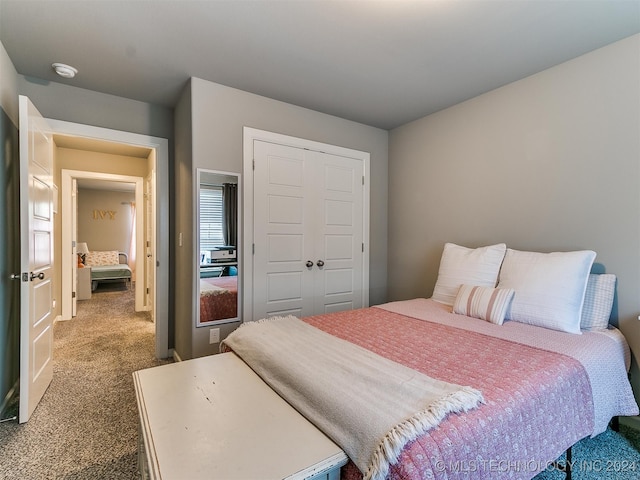 carpeted bedroom with a closet