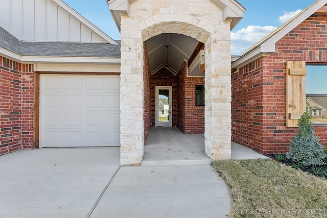 doorway to property featuring a garage