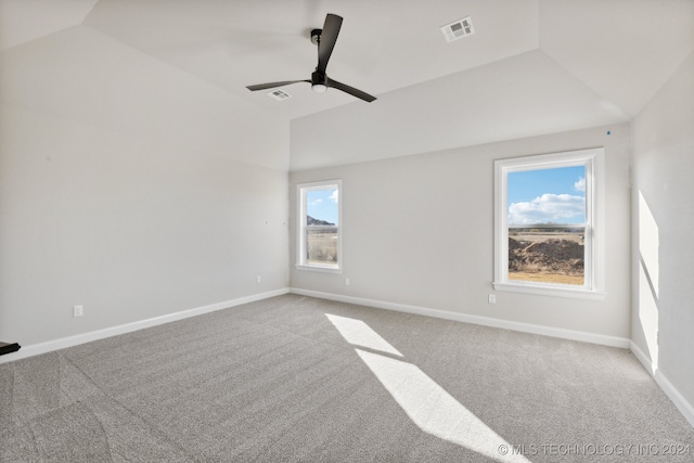 unfurnished room featuring ceiling fan, carpet, and lofted ceiling