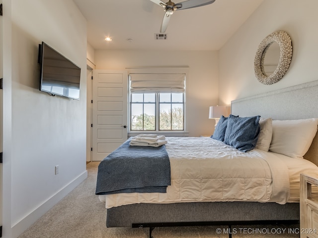 carpeted bedroom featuring ceiling fan