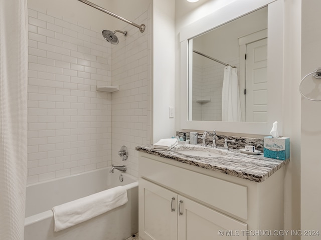 bathroom featuring shower / tub combo with curtain and vanity