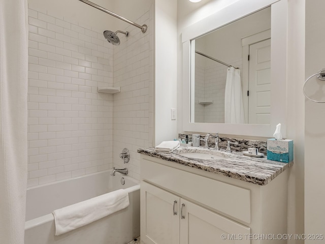 bathroom featuring vanity and shower / bathtub combination with curtain