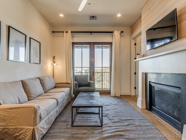 living room featuring wood-type flooring and french doors