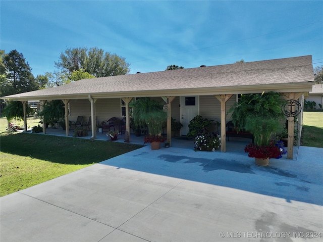 ranch-style home featuring a front yard and a patio area