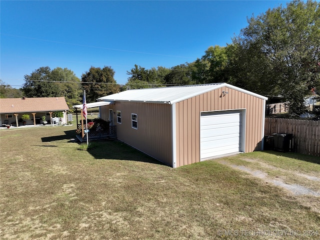 garage with a yard