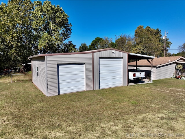 garage featuring a yard