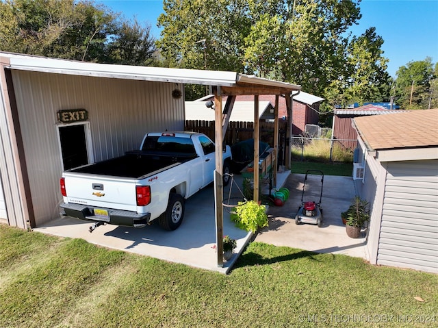 view of vehicle parking with a yard