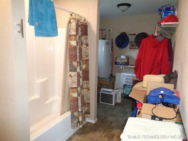 bathroom with shower / bath combo and water heater